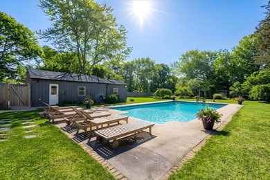 Set on a beautifully cleared, uniquely spacious 0.99-acre - photo 3