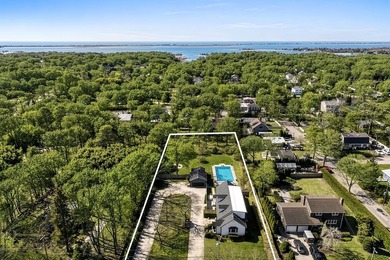 Set on a beautifully cleared, uniquely spacious 0.99-acre - photo 8