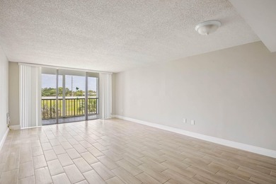 Beautiful 1-bedroom condo featuring updated flooring and a - photo 2