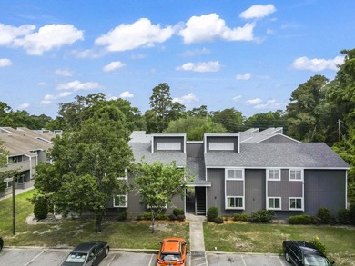 Experience easy coastal living in this beautifully updated - photo 1