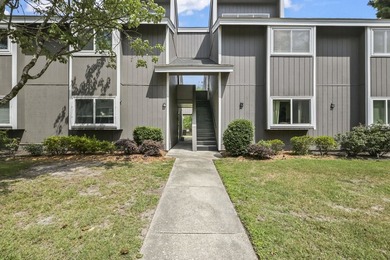 Experience easy coastal living in this beautifully updated - photo 2