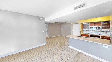 This 12th-floor unit in The Slade offers breathtaking views of - photo 5