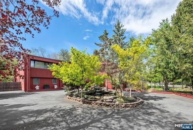 Set on a private and beautifully landscaped .8-acre property - photo 1