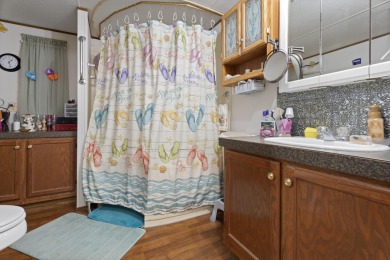 Welcome to this beautifully maintained 3-bedroom, 2-bathroom