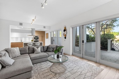 Experience refined townhouse-style living in the heart of - photo 1