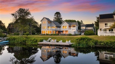 Perched at the water's edge, 19 Teal Drive is a custom-built - photo 1