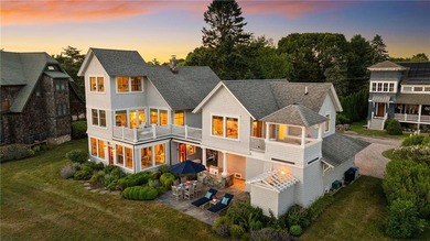 Perched at the water's edge, 19 Teal Drive is a custom-built - photo 2