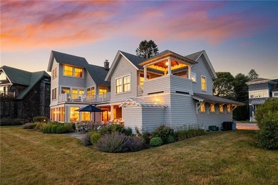 Perched at the water's edge, 19 Teal Drive is a custom-built - photo 3