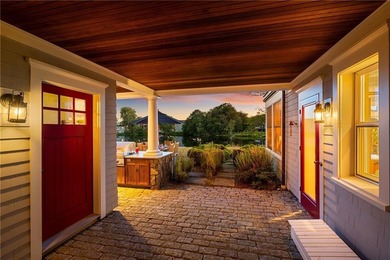 Perched at the water's edge, 19 Teal Drive is a custom-built - photo 6