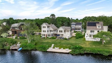 Perched at the water's edge, 19 Teal Drive is a custom-built - photo 7