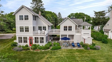 Perched at the water's edge, 19 Teal Drive is a custom-built - photo 9