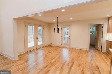 HUGE PRICE REDUCTION! LAKE HOME WITH 200 FEET OF SHORE LINE ON A - photo 11