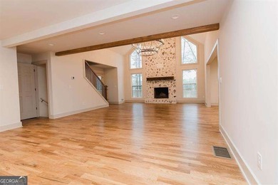 HUGE PRICE REDUCTION! LAKE HOME WITH 200 FEET OF SHORE LINE ON A - photo 12