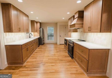 HUGE PRICE REDUCTION! LAKE HOME WITH 200 FEET OF SHORE LINE ON A - photo 13
