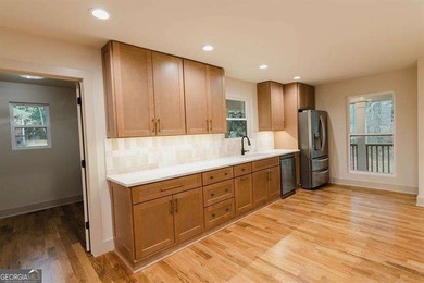 HUGE PRICE REDUCTION! LAKE HOME WITH 200 FEET OF SHORE LINE ON A - photo 14