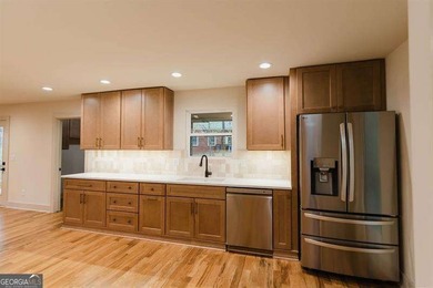 HUGE PRICE REDUCTION! LAKE HOME WITH 200 FEET OF SHORE LINE ON A - photo 15