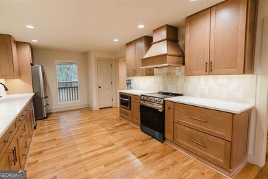 HUGE PRICE REDUCTION! LAKE HOME WITH 200 FEET OF SHORE LINE ON A - photo 16