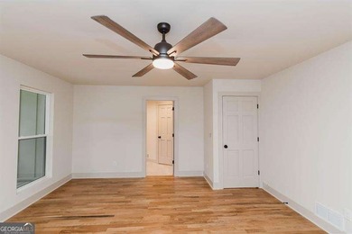 HUGE PRICE REDUCTION! LAKE HOME WITH 200 FEET OF SHORE LINE ON A - photo 21