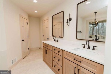 HUGE PRICE REDUCTION! LAKE HOME WITH 200 FEET OF SHORE LINE ON A - photo 25