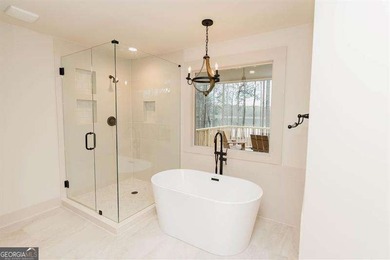 HUGE PRICE REDUCTION! LAKE HOME WITH 200 FEET OF SHORE LINE ON A - photo 27