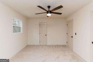 HUGE PRICE REDUCTION! LAKE HOME WITH 200 FEET OF SHORE LINE ON A - photo 33