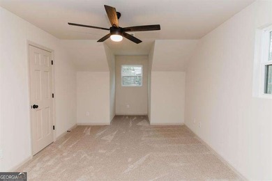 HUGE PRICE REDUCTION! LAKE HOME WITH 200 FEET OF SHORE LINE ON A - photo 34