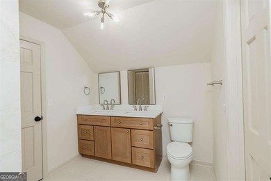 HUGE PRICE REDUCTION! LAKE HOME WITH 200 FEET OF SHORE LINE ON A - photo 39