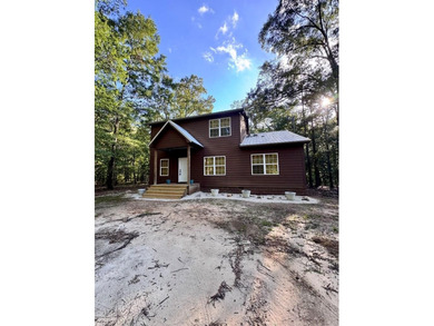 Welcome to your dream lake retreat at 61 Estate Drive in Fort - photo 1