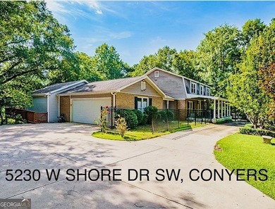 This sprawling lake estate featuring six bedrooms and five baths - photo 2