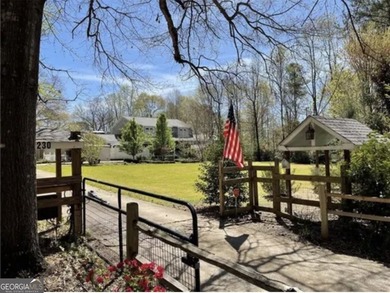 This sprawling lake estate featuring six bedrooms and five baths - photo 4