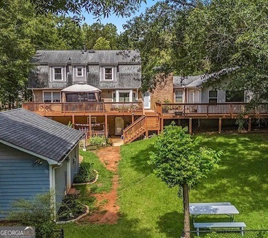 This sprawling lake estate featuring six bedrooms and five baths - photo 8