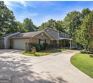 This sprawling lake estate featuring six bedrooms and five baths - photo 9