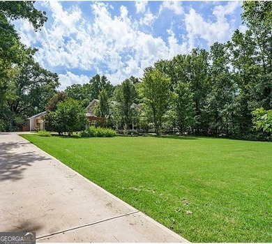 This sprawling lake estate featuring six bedrooms and five baths - photo 10