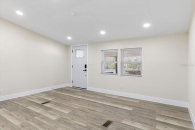Beautifully remodeled lakefront 3-bedroom 2 bathroom home with - photo 3