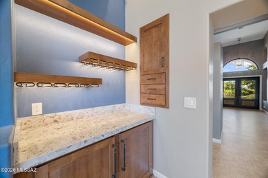 Perched atop a scenic hill in the prestigious Oro Valley Heights