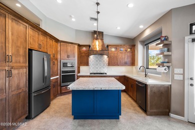 Perched atop a scenic hill in the prestigious Oro Valley Heights