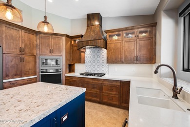 Perched atop a scenic hill in the prestigious Oro Valley Heights