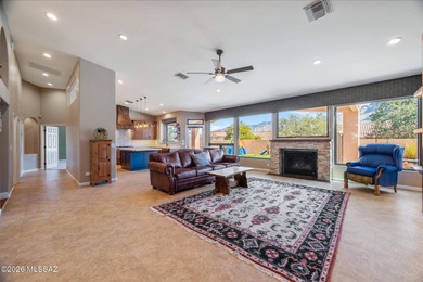 Perched atop a scenic hill in the prestigious Oro Valley Heights