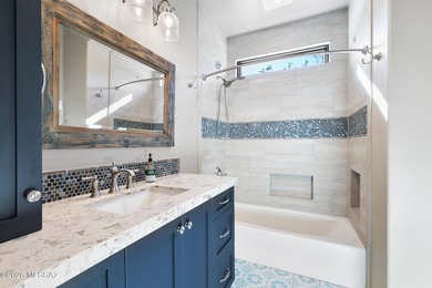 Perched atop a scenic hill in the prestigious Oro Valley Heights