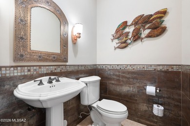 Perched atop a scenic hill in the prestigious Oro Valley Heights