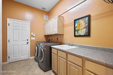 Perched atop a scenic hill in the prestigious Oro Valley Heights