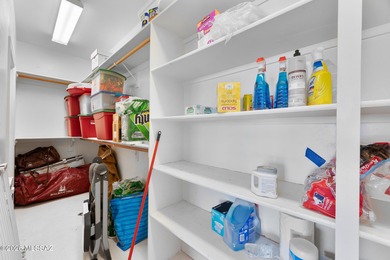 Perched atop a scenic hill in the prestigious Oro Valley Heights