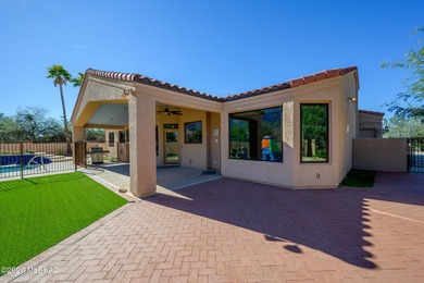 Perched atop a scenic hill in the prestigious Oro Valley Heights