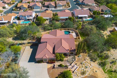 Perched atop a scenic hill in the prestigious Oro Valley Heights