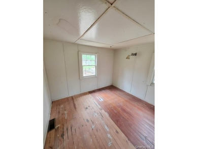 Located in the serene lakeside community of Smallwood, this - photo 5
