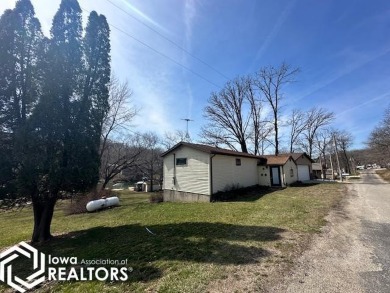 Discover a rare gem on the market: a flat, lakefront lot that's - Lake Home For Sale in Brooklyn, Iowa