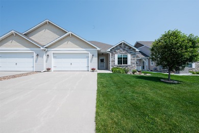 55+ Low Maintenance Living in Huxley! This townhome boasts over