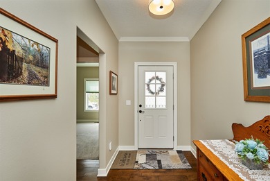 55+ Low Maintenance Living in Huxley! This townhome boasts over