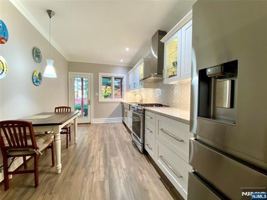 Beautifully updated ranch set atop a private 1.6-acre lot at the - photo 12