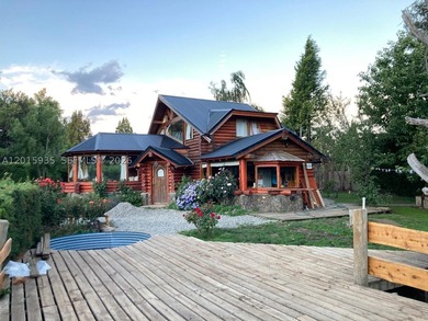 Exceptional handcrafted log home built with solid cypress logs - photo 1